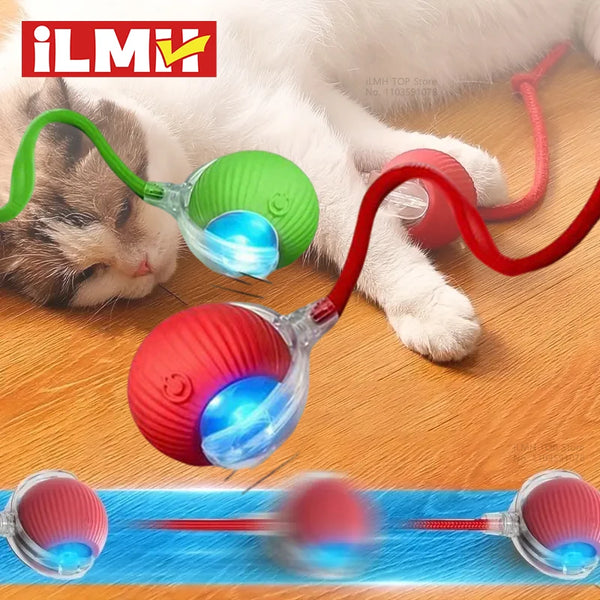 A cat is interacting with a self-moving automatic teaser ball toy featuring various colored silicone balls and a blue light.