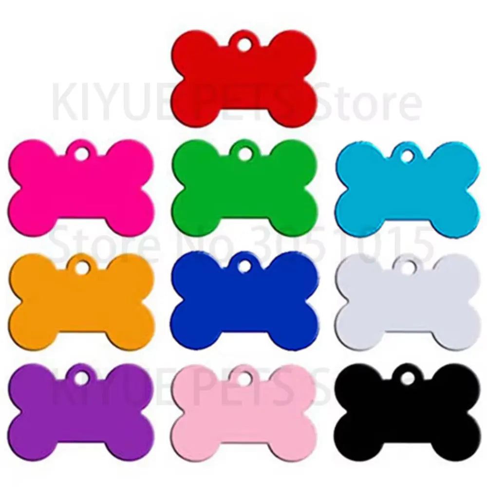 A collection of bone-shaped dog ID tags in various bright colors including red, green, blue, pink, orange, purple, and black.