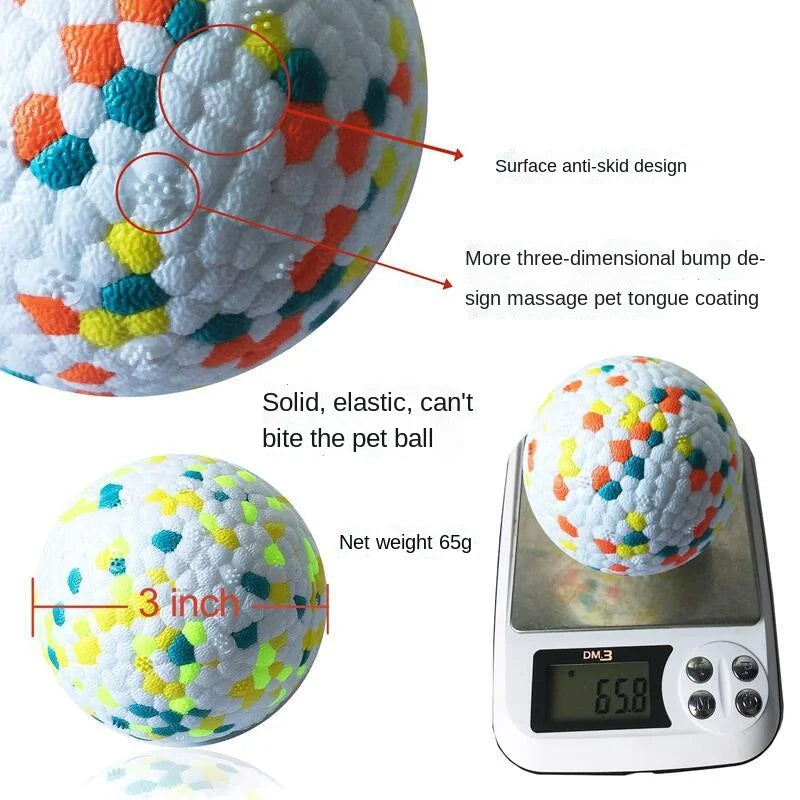A white, textured rubber ball toy with colorful bumps and a scale showing its weight.