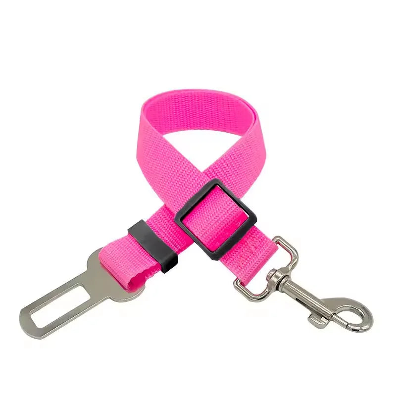Pink adjustable pet car safety harness with a seat belt clip