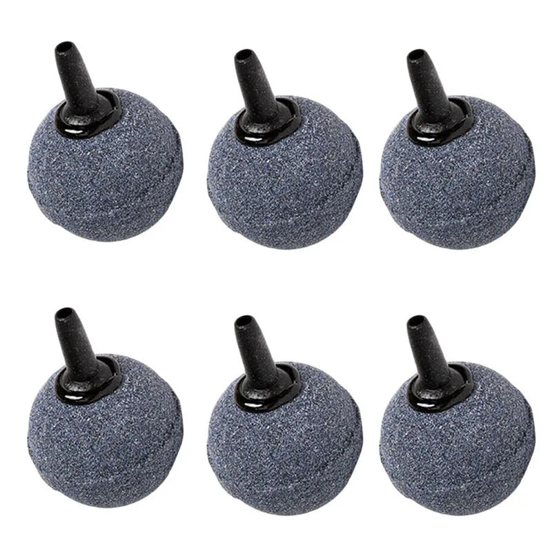 A set of four gray aquarium air stone diffusers with black nozzles.