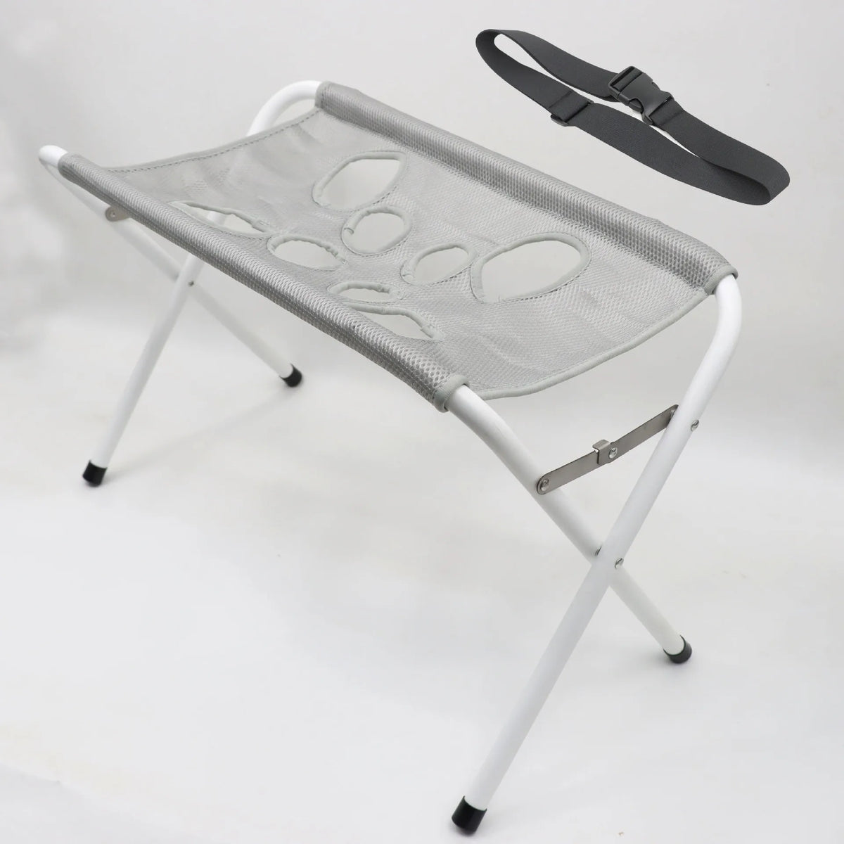 A gray foldable pet grooming hammock station with a black strap is shown against a white background.