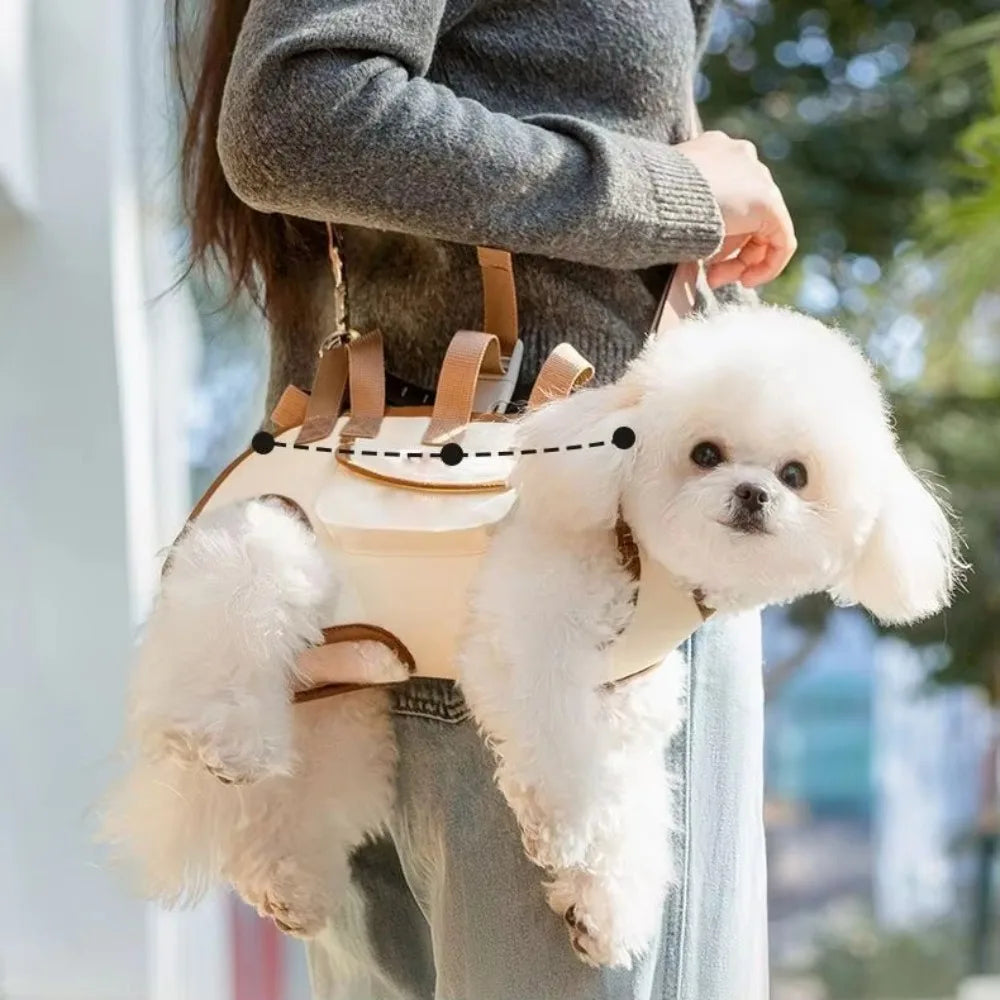 A person is carrying a fluffy white dog in a beige pet sling carrier.