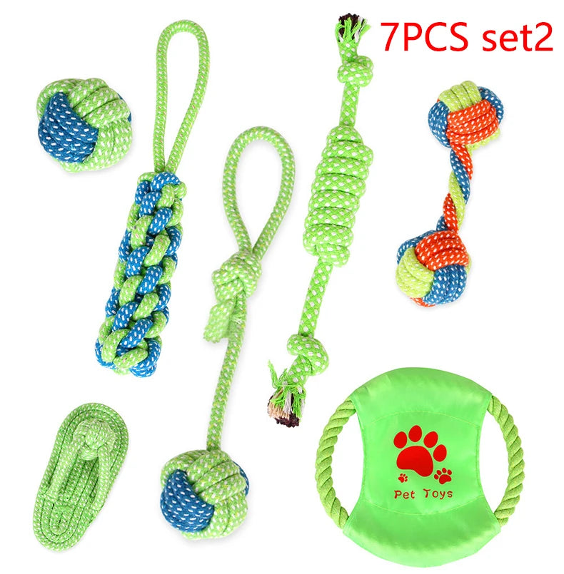 A set of seven green and blue cotton rope dog toys including a chew toy and a green silicone pet mat.