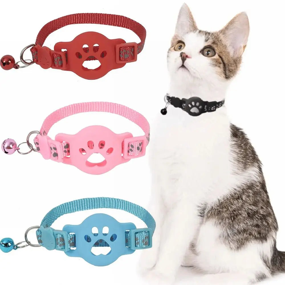 Three brightly colored reflective breakaway cat collars are displayed next to a white cat.