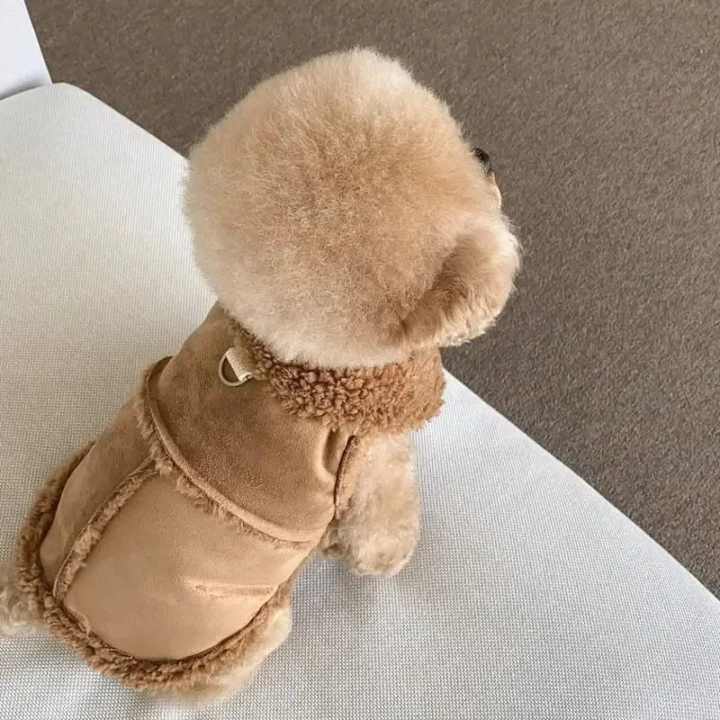 A tan luxury cotton dog vest with a fluffy brown collar and trim, shown on a white surface.