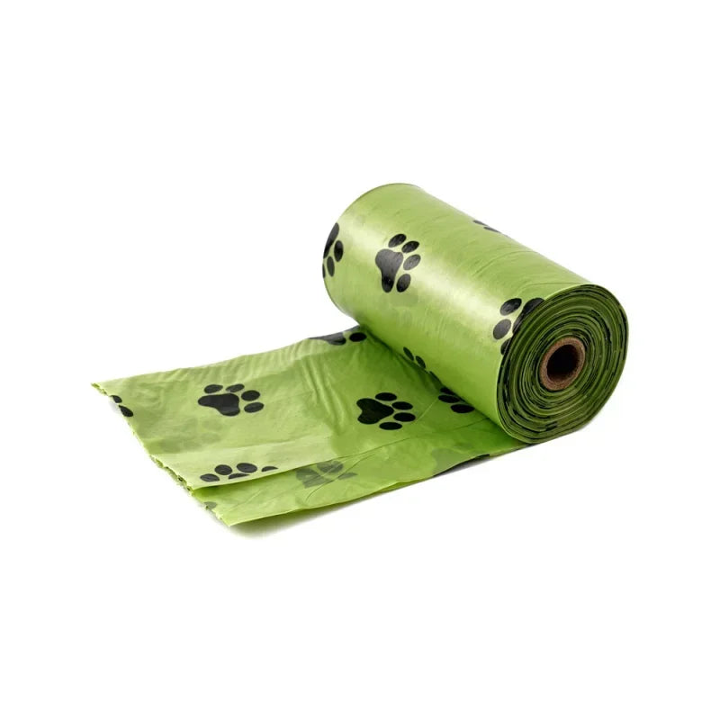 Roll of green heavy duty pet waste bags with black paw prints