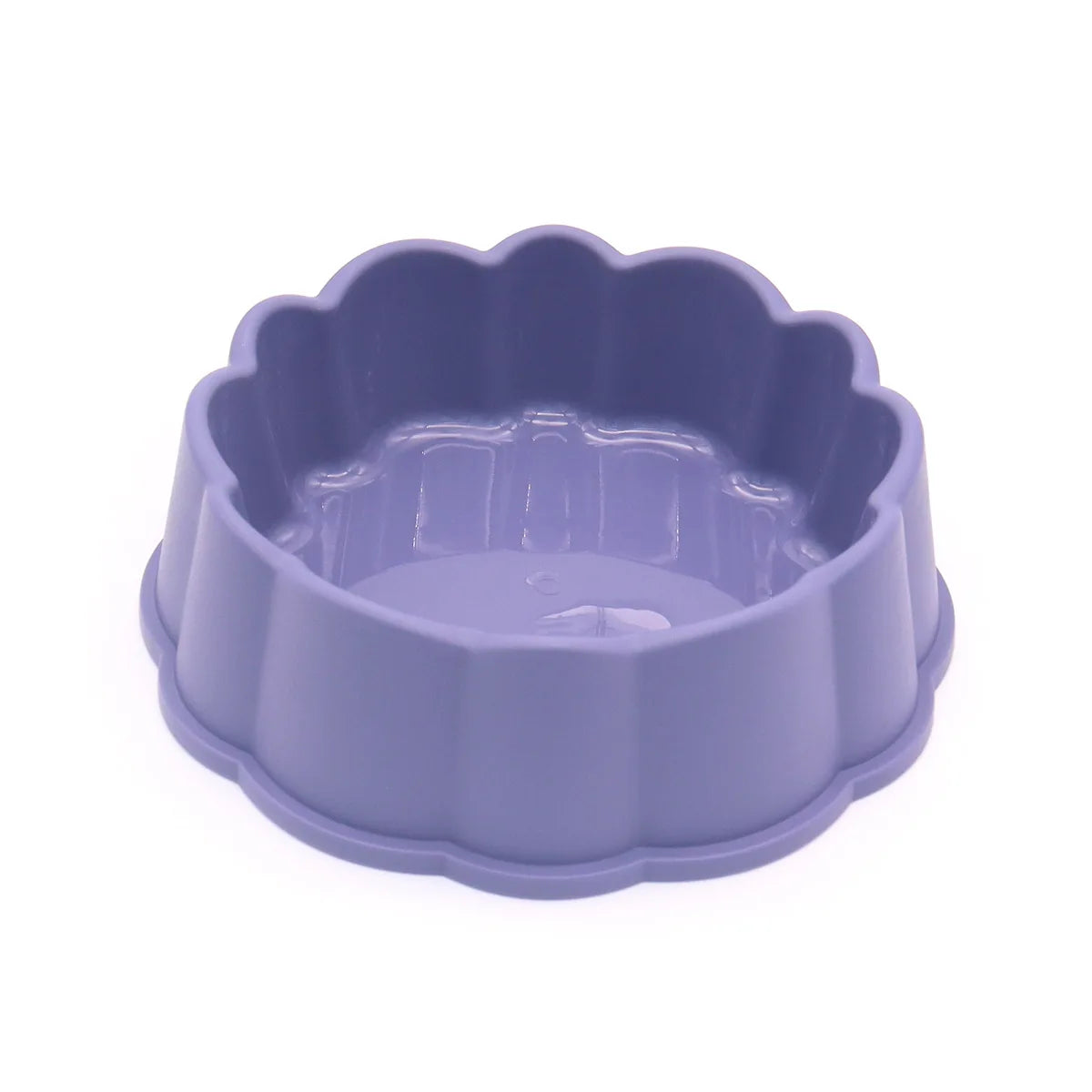 A purple non-slip pet feeding bowl for food and water with a scalloped edge.
