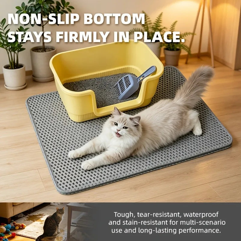 A fluffy gray cat lies on a yellow non-slip litter mat placed on a wooden floor.