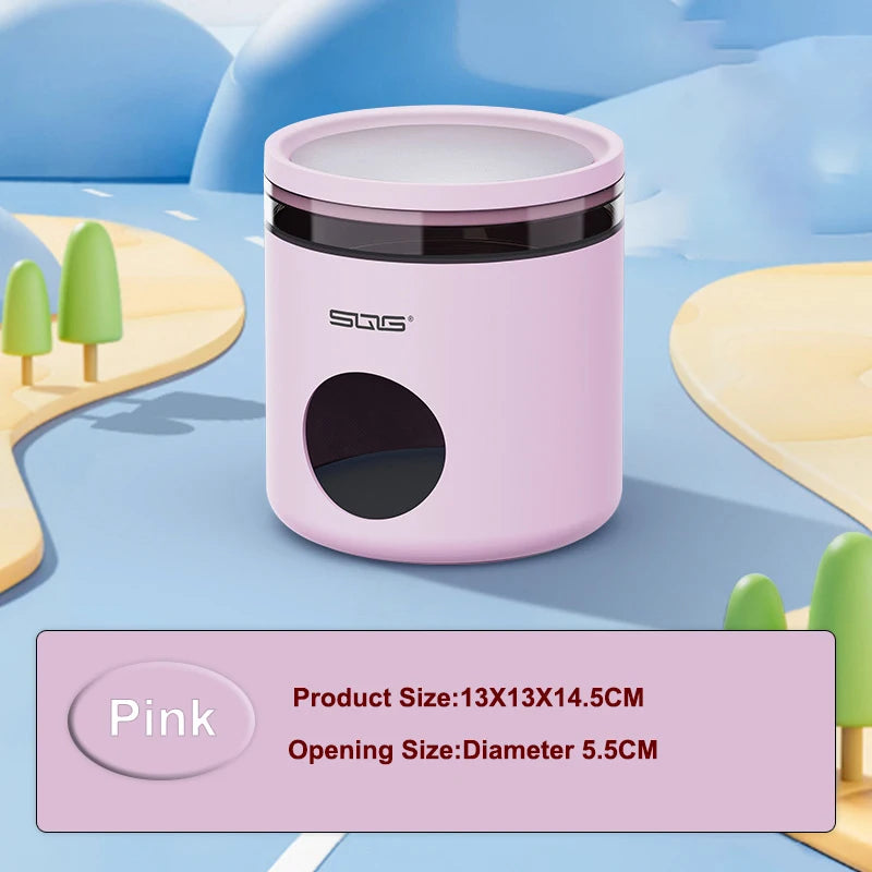 A pink cooling hideout container with a black lid and a circular opening is shown on a light blue surface.