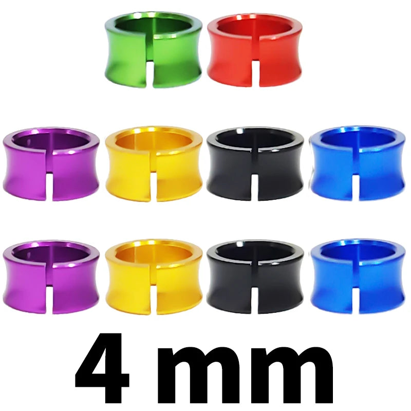 Four rings of assorted colors including green, red, purple, yellow, black, and blue, measuring 4 mm.