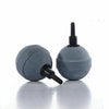 A gray aquarium air stone set with a black diffuser nozzle resting on a reflective surface.