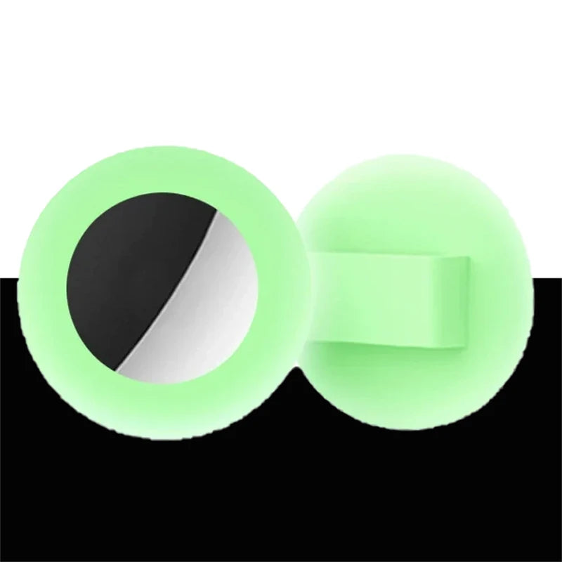 A silicone collar holder for pets, featuring a light green ring with a black and white window.