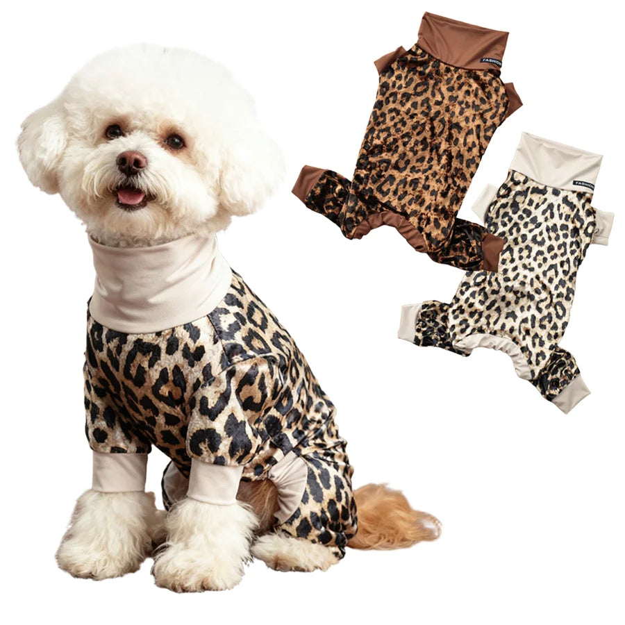 A fluffy white dog wearing a leopard print jumpsuit and matching paw boots.