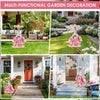 A pink and white floral goose outfit for multi-functional garden decoration displayed in a yard setting.