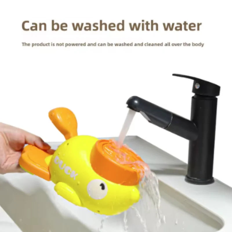 A yellow duck-shaped puzzle toy is being washed with water.