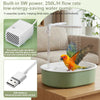 A small white electric bird bath with a water pump is shown next to a bird bathing in the water.