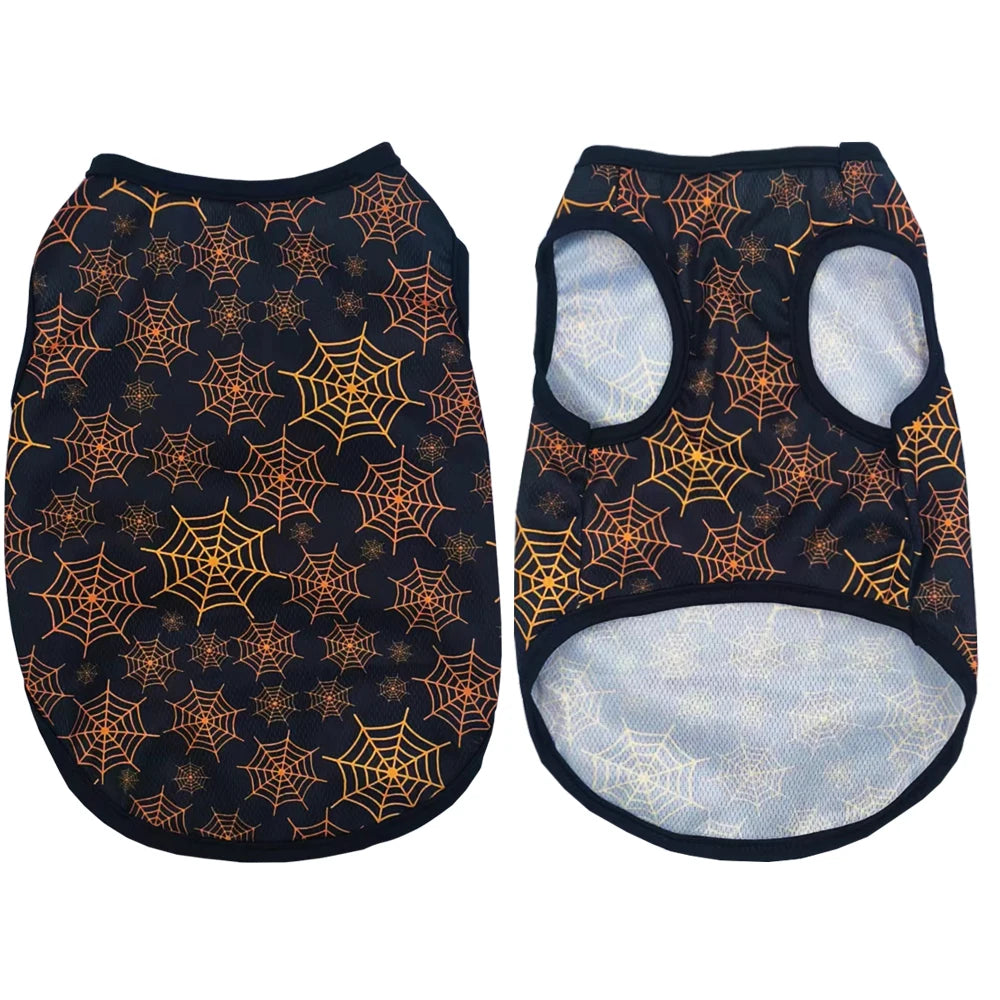 A pair of pet shirts featuring an orange Halloween pumpkin print on a black fabric.