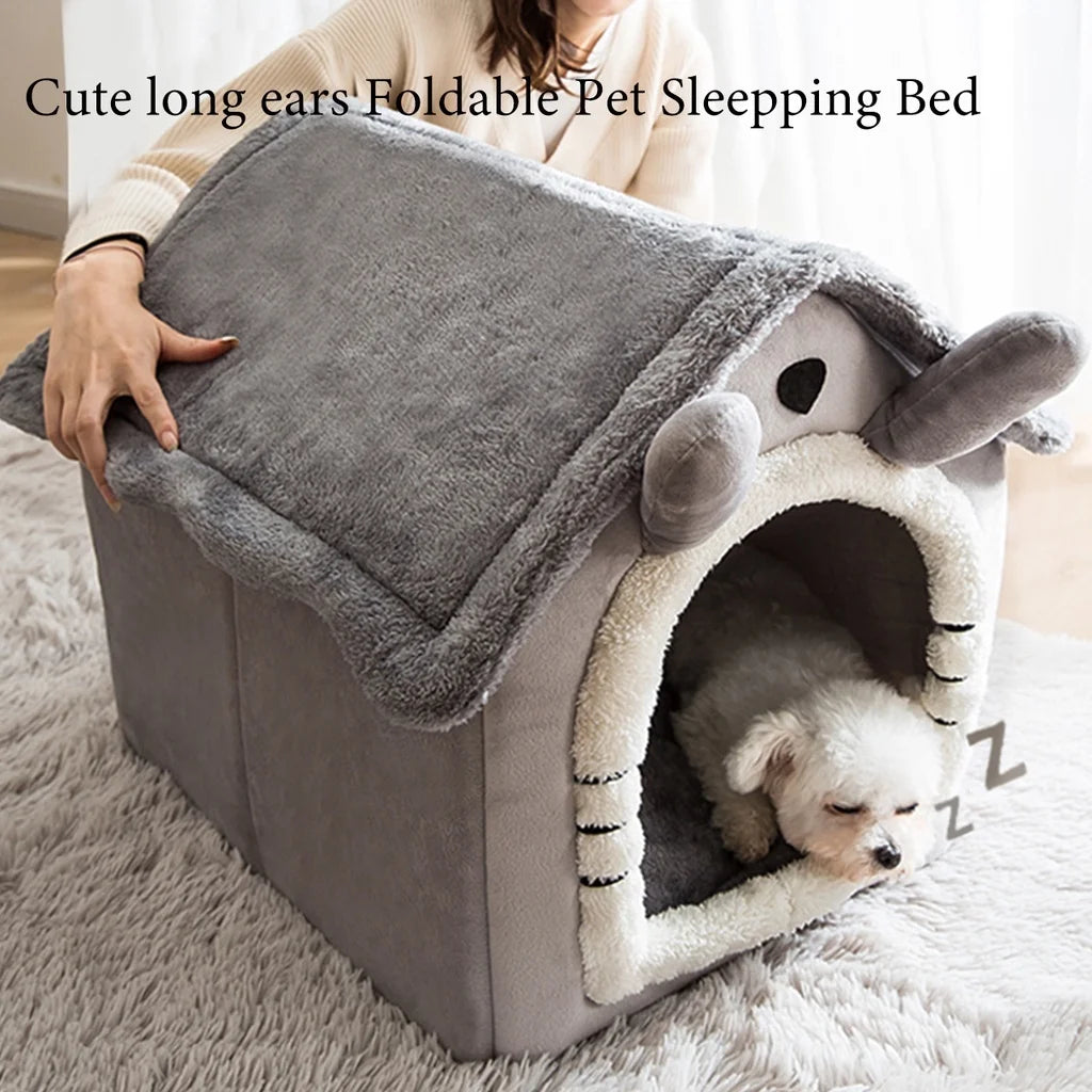 A gray foldable pet sleeping bed shaped like a house with an entrance for a small dog.