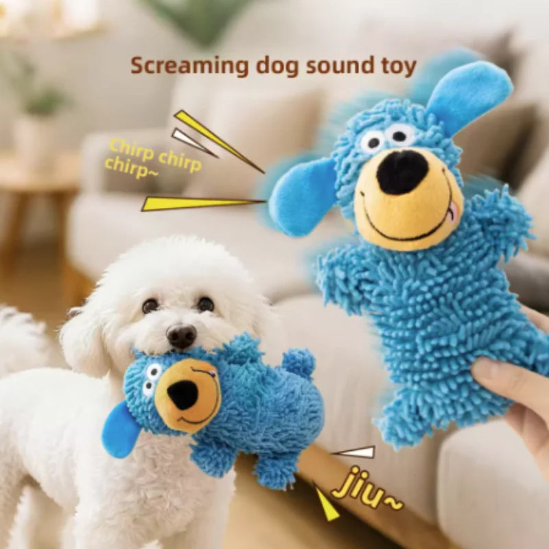 A blue screaming dog sound toy plush is being played with by a white puppy.