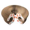 A brown accordion cat scratcher with white and orange paw print accents.