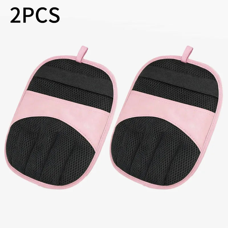 A pair of pink and black reusable pet hair removal gloves.