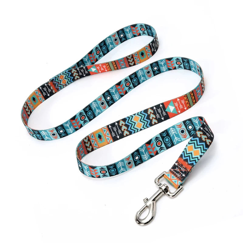 An ethnic striped pattern dog leash featuring a colorful fabric strap and a metal D-ring clip.