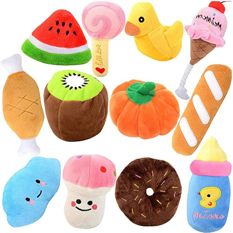 A collection of bone-shaped squeaky plush dog toys and food-themed plush items in various colors like orange yellow pink and 
