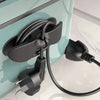 A black heavy-duty silicone cable organizer is mounted on a light blue cabinet, featuring a flexible cord for household wires