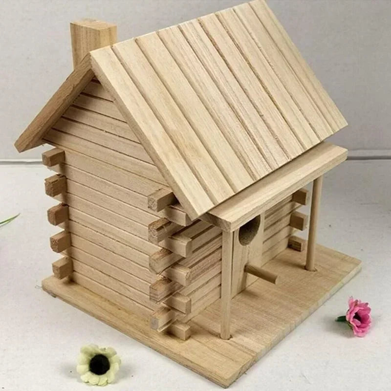 A wooden bird nesting box with a pitched roof and siding made of light natural wood.