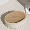 Oval sisal cat scratching board with a resting nest made of natural woven fibers.