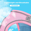 Close-up of a pink breathable dog harness material with a mesh pattern against a blue sky background.