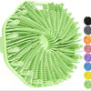 A green silicone exfoliating brush with numerous bristles arranged in a radial pattern for gentle body scrubbing.