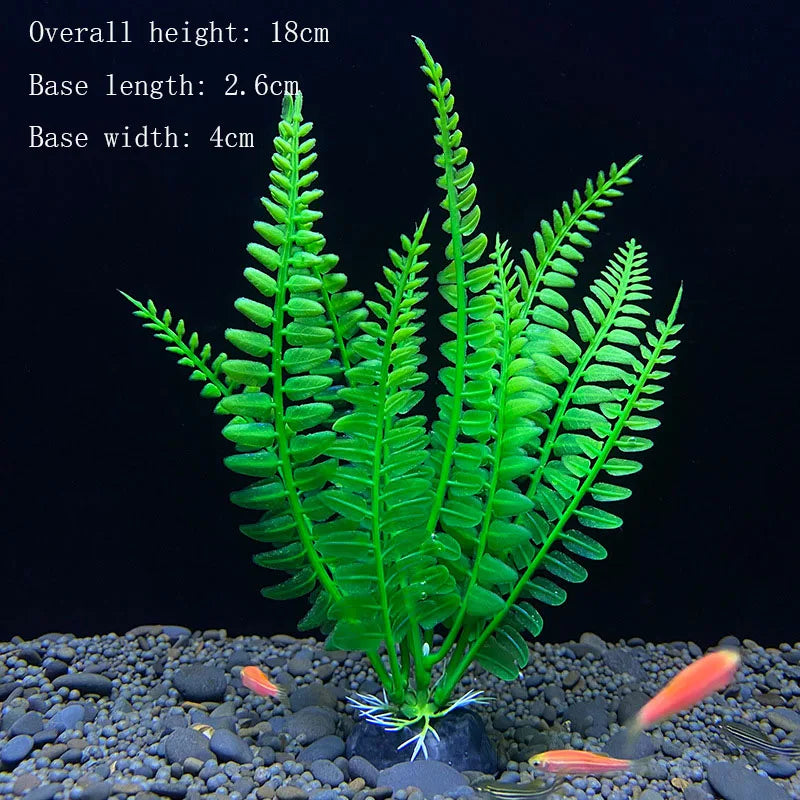A vibrant green artificial aquarium plant with fine fronds is displayed on a dark gravel substrate.