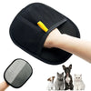 A black pet hair removal grooming glove is shown being used on a hand, with several cats and a dog visible below.