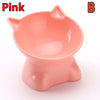 A pink ergonomic elevated pet bowl with storage for cats and dogs.