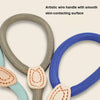 Close-up of an artistic wire handle for a dog leash, showing smooth skin-contacting surfaces in gray and blue.