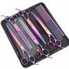 A set of professional stainless steel pet grooming scissors and a comb in a black case.