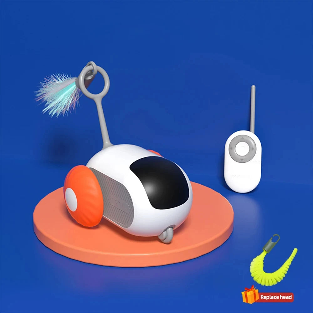 Voiture jouet chat télécommandée blanche sur base orange avec tête de remplacement jaune à proximité.