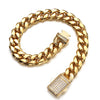 A gold-toned stainless steel curb chain bracelet with a diamond-encrusted clasp and a diamond-studded pendant.