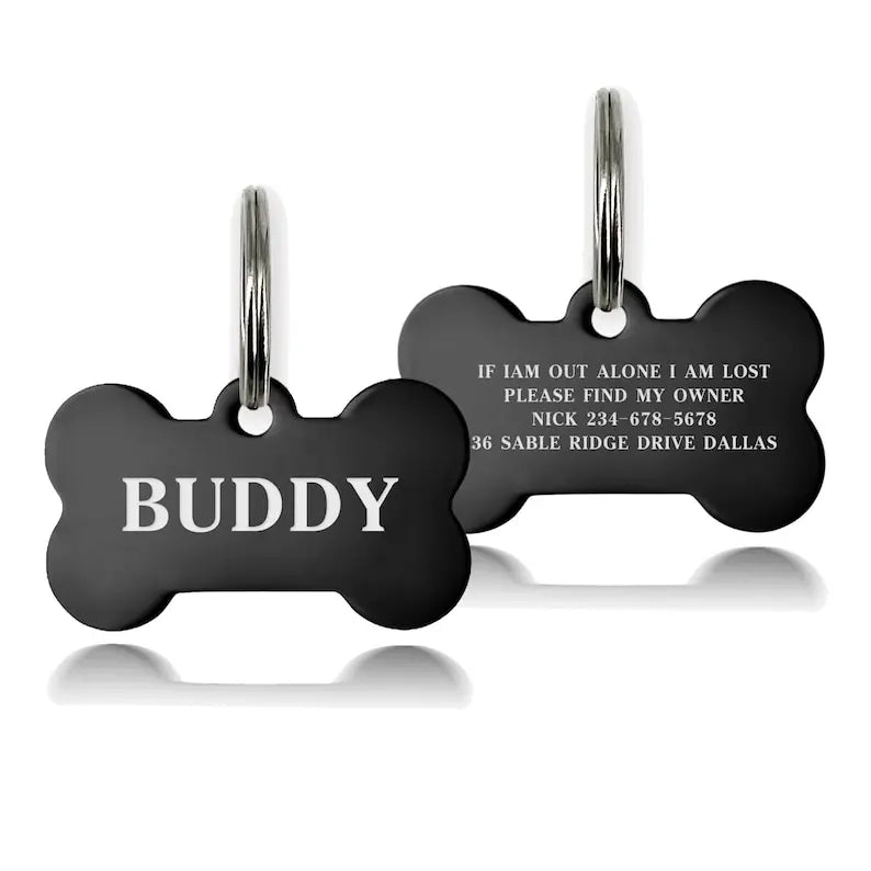 Black stainless steel bone-shaped pet ID tag engraved with the name Buddy