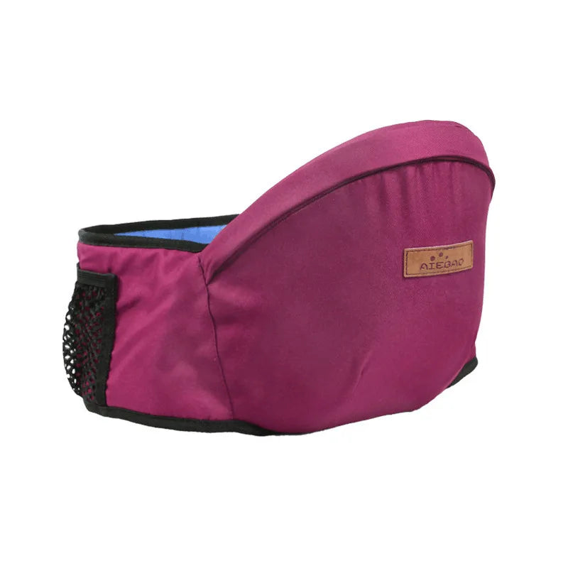Portabebés ajustable magenta con cinturón de cadera y cintura.