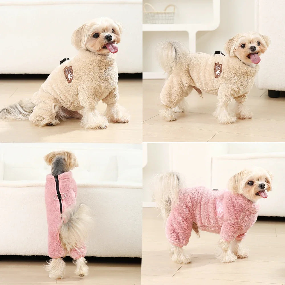 A light tan dog wearing a cozy pink fleece jumpsuit for small and medium breeds.