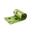 Roll of green dog poop bags with black paw prints
