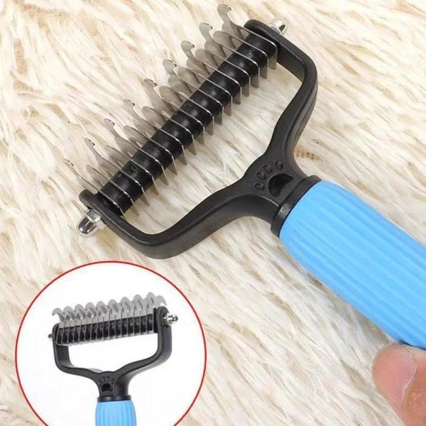 A black pet detangling comb with a blue handle is shown against a white fluffy background.