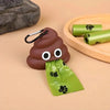 A brown silicone dog waste bag dispenser with a green silicone bag is shown on a wooden surface.
