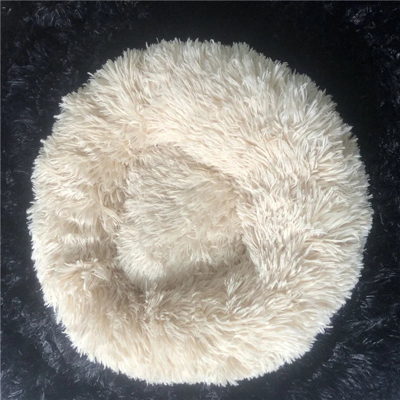 Extra large plush round pet bed with anti-slip base for dogs and cats in a cream color