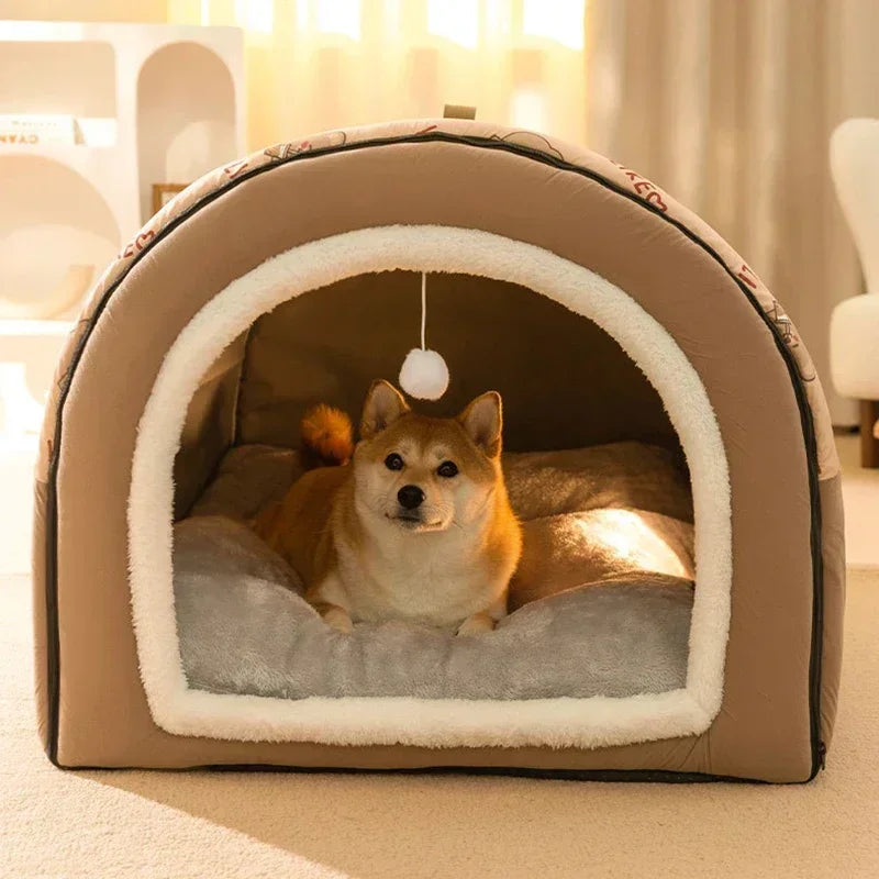 A tan pet bed with an arched entrance, featuring a fluffy dog resting inside.