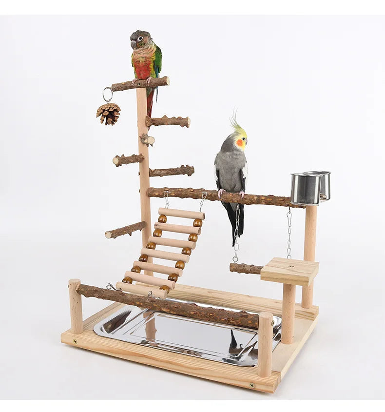 A wooden parrot climbing platform featuring branches, bridges, and a feeding station for a pet bird.