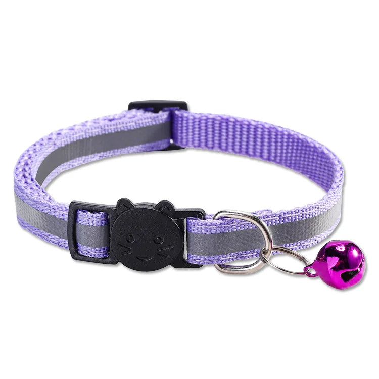 A purple nylon pet collar with a black buckle and a pink bell attached.